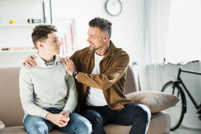 Parent Comforting His Teenage Son