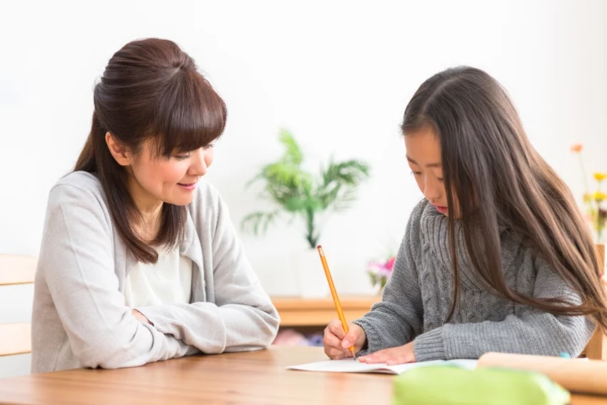 Parent Helping Their Child with 11 Plus Exam Revision