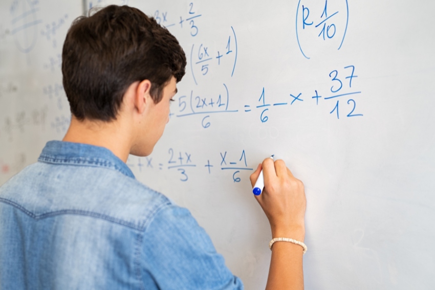 Student Studying Maths - Numbers