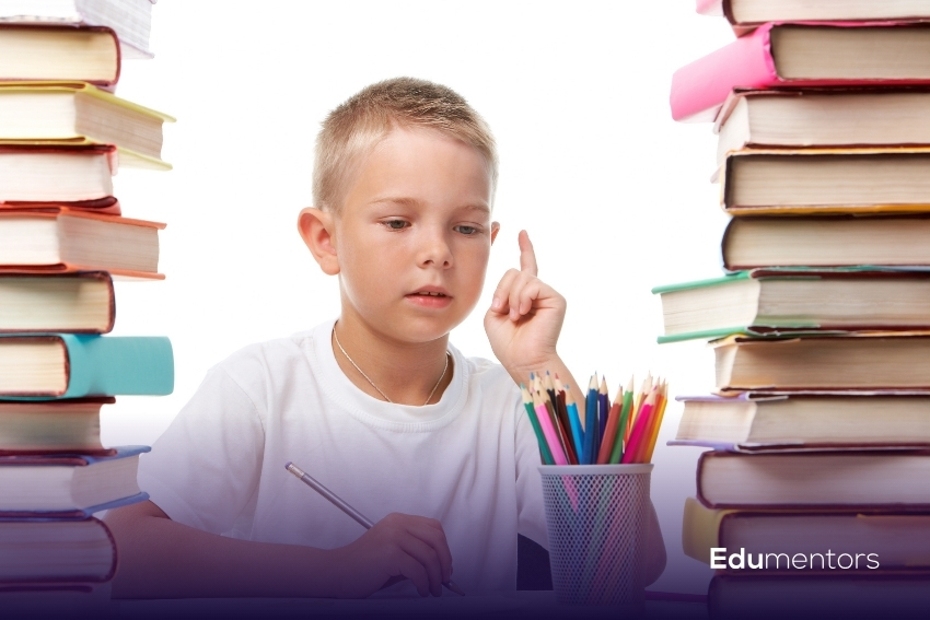 Boy solving a non verbal reasoning 11 plus practice question at his desk