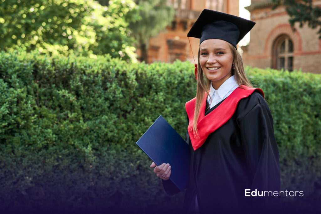 Graduate holding a certificate folder, illustrating the Arden University courses guide.